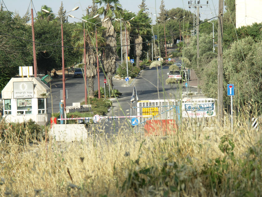 Entrance to settlement across the street