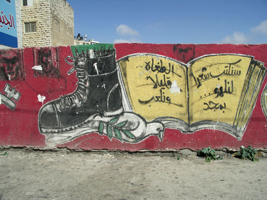 Israeli boot on dove, olive branch and with Qur'an